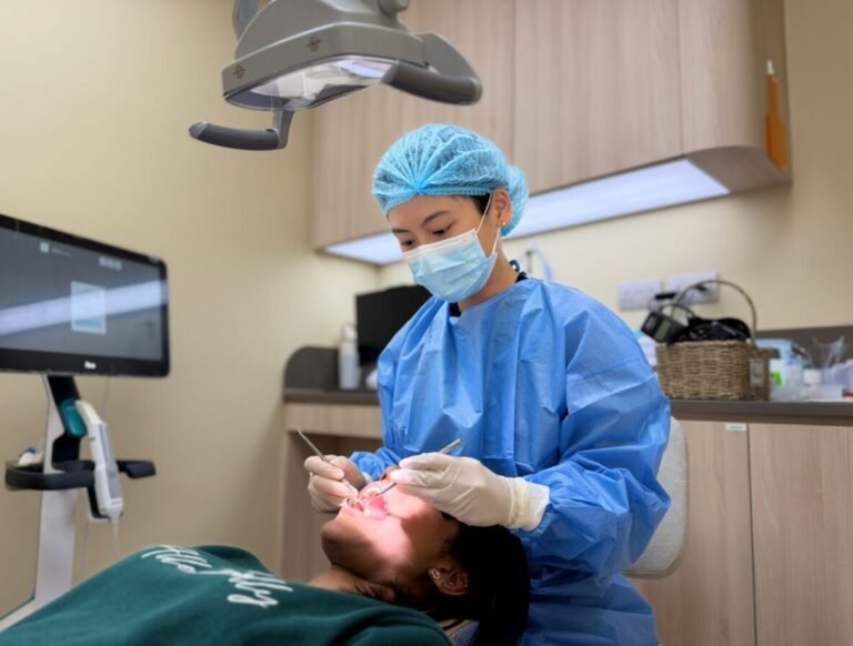 Dr Kassandra Ong (Clear Aligner and Invisalign Dentist) Doing Thorough Dental Assessment for Invisalign Patient - kohe™ Dental